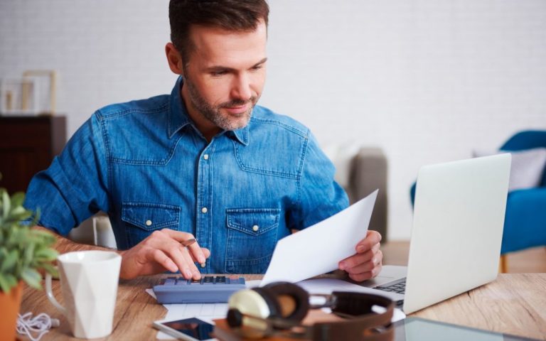 businessman-calculating-his-monthly-expenses-2021-08-26-20-15-40-utc-1-1080x675